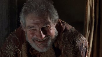 Movie still from “A Christmas Carol” (1999), directed by David Hugh Jones – An older man with a beard and a mustache; Close Up shot, Low angle