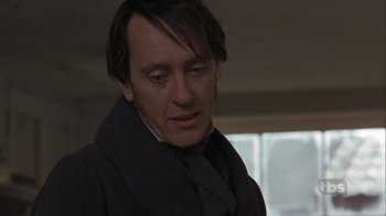 Movie still from “A Christmas Carol” (1999), directed by David Hugh Jones – A person wearing a suit and tie; Close Up shot, Low angle