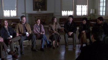 Movie still from “A Civil Action” (1998), directed by Steven Zaillian – A group of people sitting in a room; Wide shot, High angle