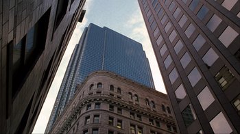 Movie still from “A Civil Action” (1998), directed by Steven Zaillian – Looking up at a tall skyscraper in a city; Extreme Wide shot, High angle