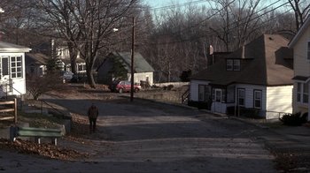 Movie still from “A Civil Action” (1998), directed by Steven Zaillian – An animal walking down the middle of a street; Extreme Wide shot, High angle