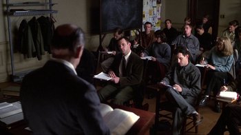 Movie still from “A Civil Action” (1998), directed by Steven Zaillian – A group of people sitting in a room with books; Medium shot, High angle
