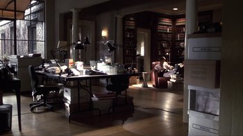 Movie still from “A Civil Action” (1998), directed by Steven Zaillian – A living room filled with lots of furniture and lights; Wide shot, High angle