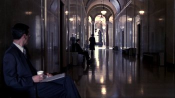 Movie still from “A Civil Action” (1998), directed by Steven Zaillian – People are walking down a long hallway in a building; Wide shot, High angle