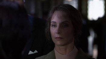 Movie still from “A Civil Action” (1998), directed by Steven Zaillian – A person sitting in a chair; Close Up shot, Over the shoulder angle