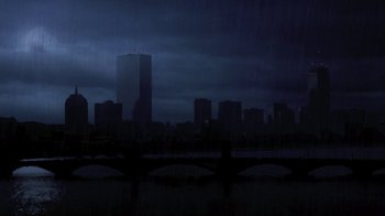 Movie still from “A Civil Action” (1998), directed by Steven Zaillian – A city skyline with a dark sky at night time; Extreme Wide shot, High angle