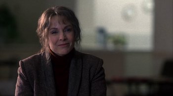 Movie still from “A Civil Action” (1998), directed by Steven Zaillian – A person wearing a jacket; Close Up shot, Over the shoulder angle