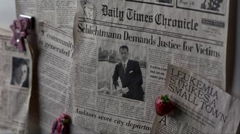 Movie still from “A Civil Action” (1998), directed by Steven Zaillian – A newspaper with a picture on it; Extreme Close Up shot, High angle