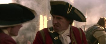 Movie still from “Tristram Shandy” (2005), directed by Michael Winterbottom – A person wearing a hat; Close Up shot, Over the shoulder angle