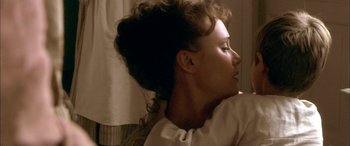 Movie still from “Tristram Shandy” (2005), directed by Michael Winterbottom – A person wearing a white shirt; Close Up shot, Over the shoulder angle
