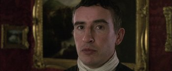 Movie still from “Tristram Shandy” (2005), directed by Michael Winterbottom – A person wearing a neck brace; Close Up shot, Low angle