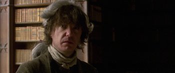 Movie still from “Tristram Shandy” (2005), directed by Michael Winterbottom – A person wearing a hat; Close Up shot, Low angle