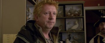 Movie still from “Tristram Shandy” (2005), directed by Michael Winterbottom – A person wearing a jacket; Close Up shot, High angle