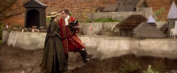 Movie still from “Tristram Shandy” (2005), directed by Michael Winterbottom – A man and a woman dressed in period clothing; Wide shot, Over the shoulder angle