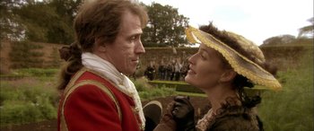Movie still from “Tristram Shandy” (2005), directed by Michael Winterbottom – A man and a woman in medieval garb looking at one another; Medium shot, Over the shoulder angle