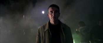 Movie still from “Tristram Shandy” (2005), directed by Michael Winterbottom – A man standing in the dark in front of a full moon; Close Up shot, Low angle