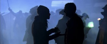 Movie still from “Tristram Shandy” (2005), directed by Michael Winterbottom – A man and a woman are talking to each other; Medium shot, Over the shoulder angle