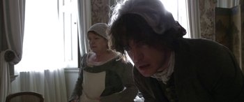 Movie still from “Tristram Shandy” (2005), directed by Michael Winterbottom – A man and a woman dressed in period clothing; Medium shot, Over the shoulder angle