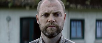 Movie still from “Department Q: A Conspiracy of Faith” (2016), directed by Hans Petter Moland – A person with a beard; Close Up shot, Low angle
