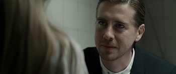 Movie still from “Department Q: A Conspiracy of Faith” (2016), directed by Hans Petter Moland – A person looking at a mirror; Close Up shot, Over the shoulder angle