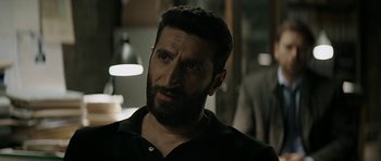 Movie still from “Department Q: A Conspiracy of Faith” (2016), directed by Hans Petter Moland – A person with a beard; Close Up shot, Over the shoulder angle