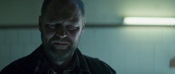 Movie still from “Department Q: A Conspiracy of Faith” (2016), directed by Hans Petter Moland – A person with his eyes wide open; Close Up shot, Over the shoulder angle