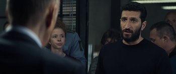 Movie still from “Department Q: A Conspiracy of Faith” (2016), directed by Hans Petter Moland – A man and a woman are standing in front of a mirror; Medium shot, Over the shoulder angle