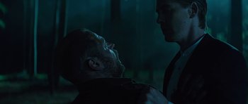 Movie still from “Department Q: A Conspiracy of Faith” (2016), directed by Hans Petter Moland – Two men in the dark , one of whom has a beard; Medium shot, Low angle