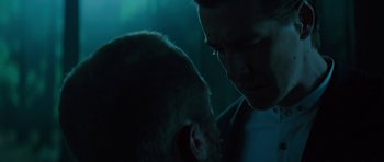 Movie still from “Department Q: A Conspiracy of Faith” (2016), directed by Hans Petter Moland – Two men are facing each other in the dark; Close Up shot, Over the shoulder angle