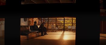 Movie still from “Department Q: A Conspiracy of Faith” (2016), directed by Hans Petter Moland – A group of people sitting in a room with windows; Extreme Wide shot, Low angle