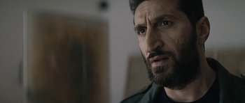 Movie still from “Department Q: A Conspiracy of Faith” (2016), directed by Hans Petter Moland – A person with a beard; Close Up shot, Over the shoulder angle