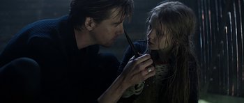 Movie still from “Department Q: A Conspiracy of Faith” (2016), directed by Hans Petter Moland – A man and a girl looking at each other; Close Up shot, Over the shoulder angle