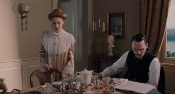 Movie still from “A Dangerous Method” (2011), directed by David Cronenberg – Two people sitting at a dining room table; Medium shot, Over the shoulder angle