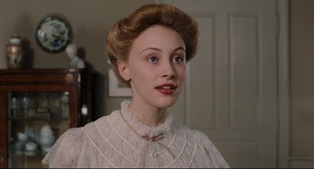 Movie still from “A Dangerous Method” (2011), directed by David Cronenberg – A young woman in a white dress with a red ribbon around her neck; Close Up shot, Low angle