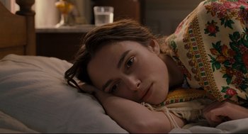 Movie still from “A Dangerous Method” (2011), directed by David Cronenberg – A woman laying in bed with her head resting on a pillow; Close Up shot, High angle