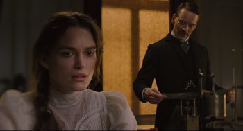 Movie still from “A Dangerous Method” (2011), directed by David Cronenberg – A man and a woman standing next to each other in a room; Medium shot, Over the shoulder angle