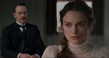Movie still from “A Dangerous Method” (2011), directed by David Cronenberg – A man and a woman sitting in front of each other; Close Up shot, Over the shoulder angle