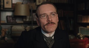 Movie still from “A Dangerous Method” (2011), directed by David Cronenberg – A man in a suit and tie with a mustache; Close Up shot, Low angle
