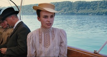 Movie still from “A Dangerous Method” (2011), directed by David Cronenberg – A young woman in a straw hat sitting on a boat; Close Up shot, Over the shoulder angle