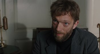Movie still from “A Dangerous Method” (2011), directed by David Cronenberg – A person with a beard; Close Up shot, Over the shoulder angle