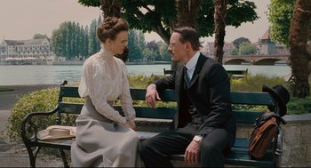Movie still from “A Dangerous Method” (2011), directed by David Cronenberg – A man and a woman sitting on a park bench; Medium shot, Low angle