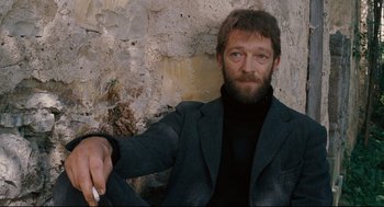 Movie still from “A Dangerous Method” (2011), directed by David Cronenberg – A man with a beard wearing a black jacket; Medium shot, High angle