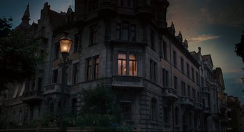 Movie still from “A Dangerous Method” (2011), directed by David Cronenberg – An old building with a window lit by a street light; Extreme Wide shot, Low angle