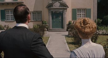 Movie still from “A Dangerous Method” (2011), directed by David Cronenberg – A man and a woman in front of a house; Medium shot, Over the shoulder angle