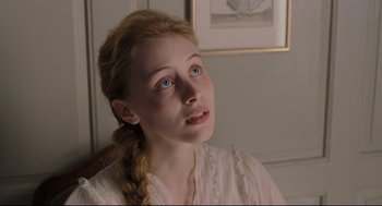 Movie still from “A Dangerous Method” (2011), directed by David Cronenberg – A woman with a braid looking up at the sky; Close Up shot, Low angle
