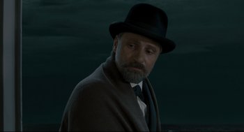 Movie still from “A Dangerous Method” (2011), directed by David Cronenberg – A man with a beard wearing a hat and a tie; Close Up shot, Low angle