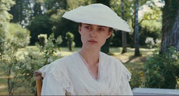 Movie still from “A Dangerous Method” (2011), directed by David Cronenberg – A woman in a white dress and a white hat; Close Up shot, Low angle