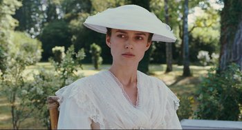 Movie still from “A Dangerous Method” (2011), directed by David Cronenberg – A woman in a white dress wearing a white hat; Close Up shot, Over the shoulder angle