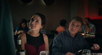 Movie still from “A Date for Mad Mary” (2016), directed by Darren Thornton – A man and a woman sitting at a table in a restaurant; Medium shot, Over the shoulder angle