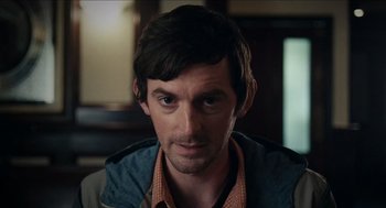 Movie still from “A Date for Mad Mary” (2016), directed by Darren Thornton – A person wearing a jacket; Close Up shot, Over the shoulder angle